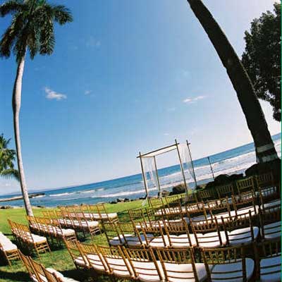 Maui beach wedding with bamboo wedding chuppa.