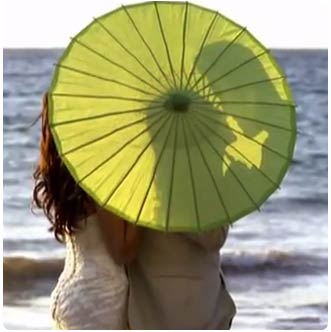 Green umbrella wedding accessory for Olowalu plantion house wedding in West Maui.