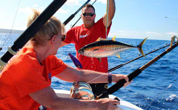 The author's wife catches a fish on Maui. Later we use it to prepare an inclusive dinner in Kaanapali.