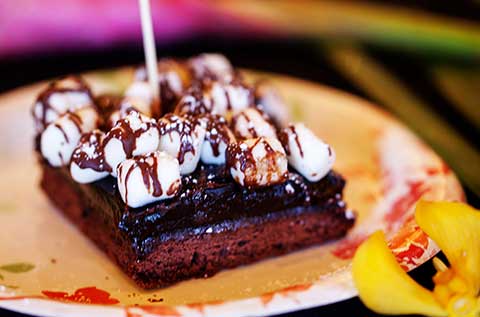 Homemade desserts like this brownie with chocolate sauce and marshmallows at CJs restaurant in Kaanapali.