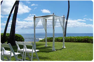 Wedding Arch in Bamboo Chuppa with the oceanfront wedding on Maui background setting image.