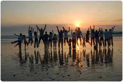 Maui family reunion at sunset after enjoying catered barbecue.