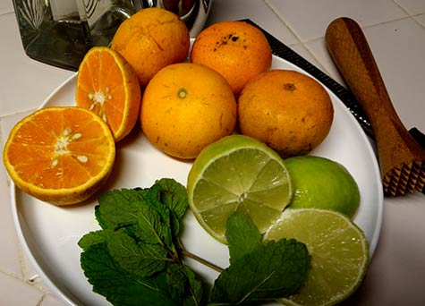 Fresh organic tropical tangerines, lemon and mint for Maui cocktails.