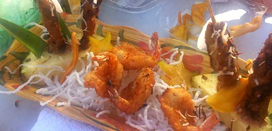Hawaiian Coconut Shrimp with chicken skewers and pineapple on Maui.