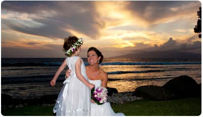 Fresh flower lei, including the Haku Hawaiian head lei at sunset Maui wedding.